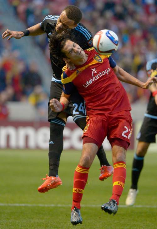 Real Salt Lake midfielder John Stertzer (27) and New York City FC defender Shay Facey (24) go up for the ball during an MLS soccer game Saturday, May 23, 2015, in Sandy, Utah. (Leah Hogsten/The Salt Lake Tribune via AP)