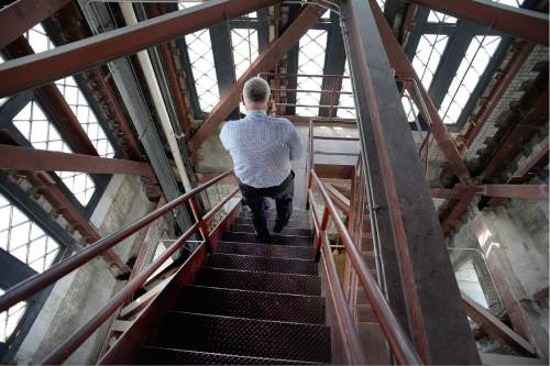 Scott Sommerdorf   |  The Salt Lake Tribune  
Alden Breinholt, the city's Operations Division director, descends one of the many stairways leading to the top of the highest tower in the City-County Building during a tour of the building, Thursday, May 26, 2016. City Hall is about to undergo a three-year renovation to repair stone work and do seismic upgrades. The first year will involve work on the tower and seismic improvements, followed by repairs on lower parts of the building in 2017 and 2018.