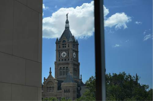 Scott Sommerdorf   |  The Salt Lake Tribune  
The historic City-County Building as seen from the main City Library, Thursday, May 26, 2016. City Hall is about to undergo a three-year renovation to repair stone work and do seismic upgrades. The first year will involve work on the tower and seismic improvements, followed by repairs on lower parts of the building in 2017 and 2018.