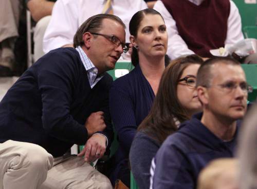 Leah Hogsten | The Salt Lake Tribune
Utah Jazz assistant general manager Justin Zanik and his wife Gina watch the team at EnergySolutions Arena during the annual scrimmage Saturday, October 5, 2013. The Zanik's daugher Ava, 6, had four brain surgeries this summer to drain a burst cyst on her brain.