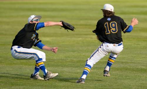 Leah Hogsten  |  The Salt Lake Tribune
Orem's Tyler Brandner (7)  and Fisher Hermansen (19) try to stop the Timberwolves scoring run in the third inning. Timpangos High School boys baseball team defeated the Orem Tigers 11-1 in 5 innings to win the 4A State Baseball Championship, May 27, 2016 at Utah Valley University's Brent Brown Ballpark.