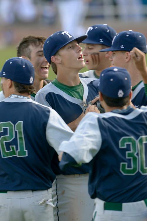 Leah Hogsten  |  The Salt Lake Tribune
Timpanogos' pitcher Derik Eaquinto celebrates the fourth inning shutout over Orem with teammates. Timpangos High School boys baseball team defeated the Orem Tigers 11-1 in 5 innings to win the 4A State Baseball Championship, May 27, 2016 at Utah Valley University's Brent Brown Ballpark.