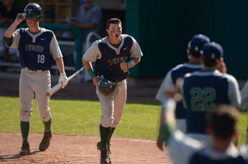 Leah Hogsten  |  The Salt Lake Tribune
Timpanogos' Cal Beardsley celebrates his first inning run with his teammates. Timpangos High School boys baseball team defeated the Orem Tigers 11-1 in 5 innings to win the 4A State Baseball Championship, May 27, 2016 at Utah Valley University's Brent Brown Ballpark.