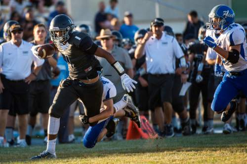 Chris Detrick  |  The Salt Lake Tribune
Summit Academy's football team had a 2016 postseason ban overturned by the UHSAA's Board of Trustees on Thursday. Text messages showed a now-former assistant coach attempted to recruit athletes from Copper Hills. "We had adults who did something they shouldn't have done and these kids are paying the price," Summit Academy argued.