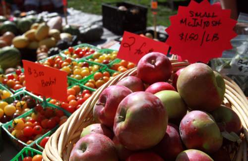 Tribune file photo
 
Fresh apples and other produce for sale at the Parker Farms stand at the Farmers Market at Pioneer Park in downtown Salt Lake City. The Downtown Farmers Market opens for the season this Saturday.
