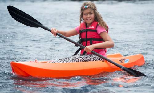 Rick Egan  |  The Salt Lake Tribune

Ava Mogilefsky, 8, paddles a kayak during Outdoor Adventure Days at the Lee Kay Public Shooting Range in Salt Lake City on Friday, June 10, 2016. The free event continues Saturday with fishing, kayaking and paddleboarding, and archery and firearms instruction.