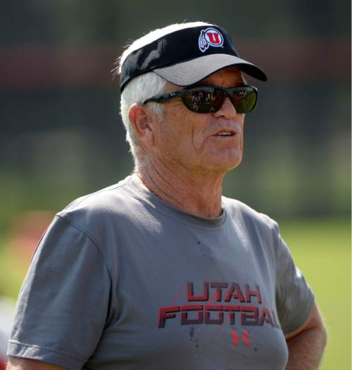 Al Hartmann  |  The Salt Lake Tribune
Assistant head coach Dennis Erickson runs the running backs during practice Monday August 17.