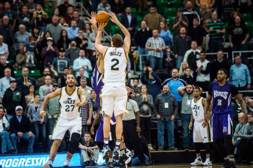 Chris Detrick  |  The Salt Lake Tribune
Utah Jazz forward Joe Ingles (2) shoots a three-pointer over Sacramento Kings center Willie Cauley-Stein (00) to tie the game at 101 during the game at Vivint Smart Home Arena Thursday January 14, 2016. Sacramento Kings defeated the Utah Jazz 103-101.