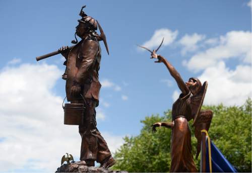 Scott Sommerdorf   |  The Salt Lake Tribune  
This pair of statues were unveiled and dedicated during a ceremony for the new Miners Memorial in Castle Dale, Utah, Saturday, June 8, 2016.