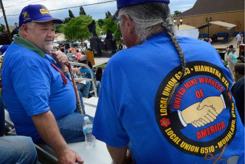 Scott Sommerdorf   |  The Salt Lake Tribune  
Former miners John Armstrong, left, and Joe Montoya, right, talk prior to the ceremony in which a pair of statues were unveiled and dedicated to all the miners who have died in Utah mining disasters, Saturday, June 8, 2016.