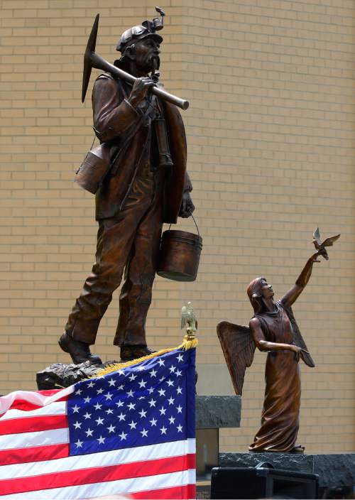 Scott Sommerdorf   |  The Salt Lake Tribune  
A pair of statues were unveiled and dedicated in Castle Dale on Saturday to all the miners who have died in Utah mining disasters.