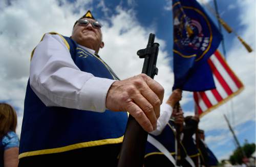 Scott Sommerdorf   |  The Salt Lake Tribune  
LaNae Jones, of the American Legion stood as part of the color guard prior to the ceremony in which a pair of statues were unveiled and dedicated to all the miners who have died in Utah mining disasters, Saturday, June 8, 2016.