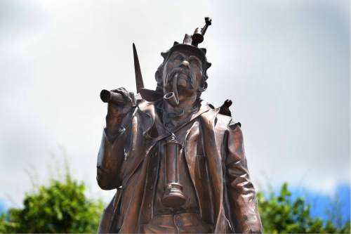 Scott Sommerdorf   |  The Salt Lake Tribune  
This statue depicting a Utah miner, along with an angel that stands next to it, were unveiled and dedicated during a ceremony for the new Miners Memorial in Castle Dale, Utah, Saturday, June 8, 2016.