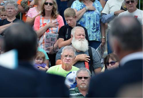 Scott Sommerdorf   |  The Salt Lake Tribune  
The crowd - many of them former miners - stood for the singing of the national anthem during a ceremony for the new Miners Memorial in Castle Dale, Utah, Saturday, June 8, 2016.