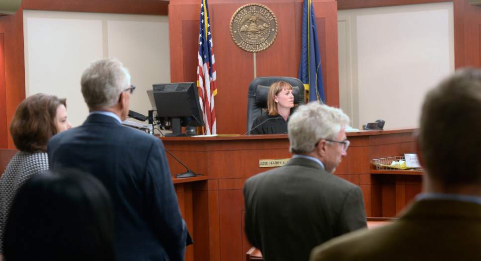 Al Hartmann  |  The Salt Lake Tribune
Judge Heather Brereton speaks to Craig Crawford via television monitor from the Salt Lake County jail in Salt Lake City Monday June 13. He is charged with first-degree felony murder for allegedly killing his estranged husband --  well-known Salt Lake City restaurateur John Williams -- in a house fire last month.  Crawford's defense lawyers Ann Marie Taliaferrro,  Jim Bradshaw and Richard Mauro are present.