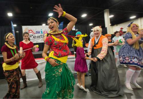 Rick Egan  |  The Salt Lake Tribune

Traditional Asian dancers join with Cosplayers at the conclusion of the 39th Utah Asian Festival, at the South Towne Exposition Center, Saturday, June 11, 2016.