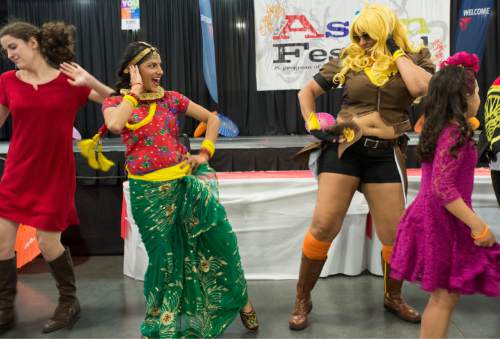 Rick Egan  |  The Salt Lake Tribune

Traditional Asian dancers join with Cosplayers at the conclusion of the 39th Utah Asian Festival, at the South Towne Exposition Center, Saturday, June 11, 2016.