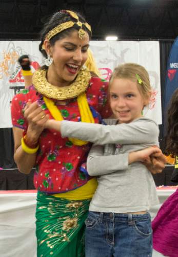 Rick Egan  |  The Salt Lake Tribune

Nepalese dancer, Anju Thapaliya dances with 9-year-old Emma Stevenson, Farmington, as the audience joined traditional Asian dancers and Cosplayers at the conclusion of the 39th Utah Asian Festival, at the South Towne Exposition Center, Saturday, June 11, 2016.