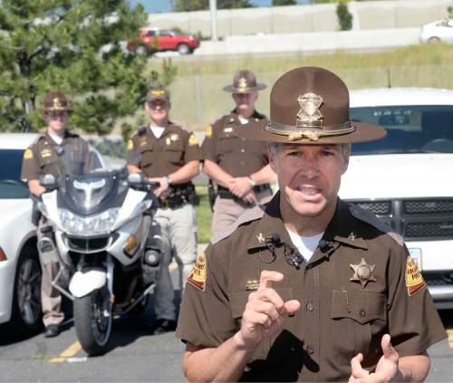 Al Hartmann  |  The Salt Lake Tribune 
Utah Highway Patrol Col. Daniel Furh speaks at a news conference in Murray Tuesday June 14 on a disastrous "100 Deadliest Days" campaign thus far this year, addressing the spike in fatalities and aggressive driving in particular.   The UHP will be pulling out all the stops using a patrol surge, including unmarked "interceptor" cruisers, and motorcycles to get people to slow down.