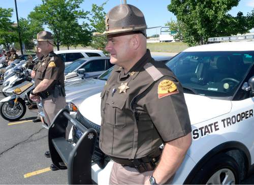 Al Hartmann  |  The Salt Lake Tribune 
Utah Highway Patrol troopers line up near their vehicles as Col. Daniel Furh speaks at a news conference in Murray Tuesday June 14 on a disastrous "100 Deadliest Days" campaign thus far this year, addressing the spike in fatalities and aggressive driving in particular.   The UHP will be pulling out all the stops using a patrol surge, including unmarked "interceptor" cruisers, and motorcycles to get people to slow down.