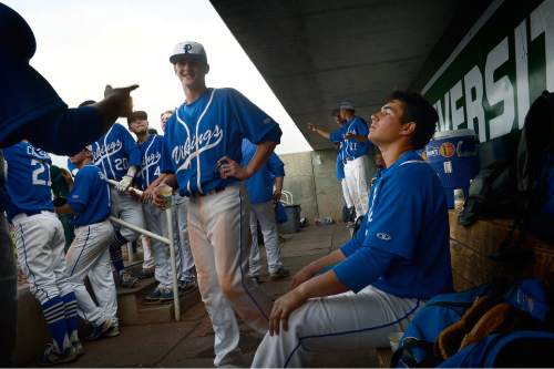 Scott Sommerdorf   |  The Salt Lake Tribune
Pleasant Grove relief pitcher Payton Henry, right, sits in the dugout prior to coming out to get the last three outs. Pleasant Grove defeated Bingham 6-2 to win the Utah 5A title, Thursday, May 21, 2015.