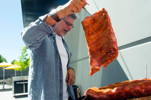 Chris Detrick  |  The Salt Lake Tribune
Barbecue expert Steven Raichlen makes Oak-Smoked Cherry-Glazed Baby Back Ribs at Thermworks in American Fork on Friday June 3, 2016.