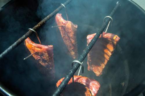 Chris Detrick  |  The Salt Lake Tribune
Barbecue expert Steven Raichlen makes Oak-Smoked Cherry-Glazed Baby Back Ribs at Thermworks in American Fork on Friday June 3, 2016.
