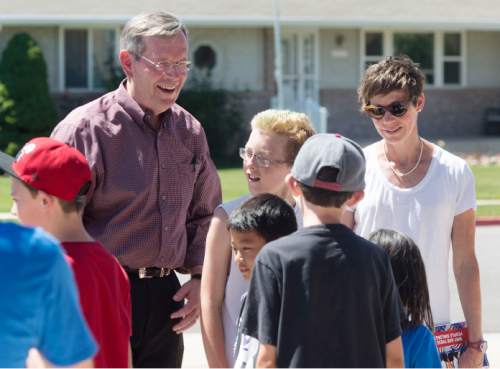 Steve Griffin / The Salt Lake Tribune

Former Gov. Mike Leavitt and Weber County Commission candidate Caitlin Gochnour stop to chat with children from the Boys and Girls Clubs of Weber-Davis the as they walk a Roy, Utah neighborhood with local candidates who support Count My Vote election reforms. The group met at the Roy Hillside Senior Citizen Center in Roy, Utah Friday June 17, 2016.