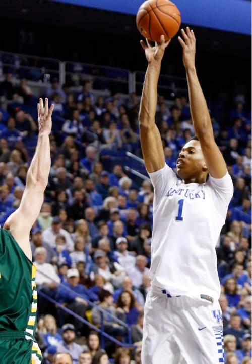 Kentucky's Skal Labissiere (1) shoots over Wright State's JT Yoho during the first half of an NCAA college basketball game Friday, Nov. 20, 2015, in Lexington, Ky. (AP Photo/James Crisp)