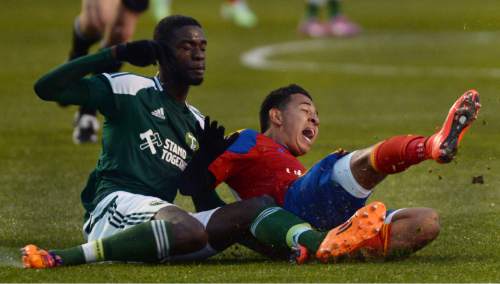 Steve Griffin  |  The Salt Lake Tribune

Sebastian Saucedo of the Real Monarchs gets tackled by Portland Timbers 2 defender Rennico Clarke at Rio Tinto Stadium in Sandy, Wednesday, April 8, 2015.