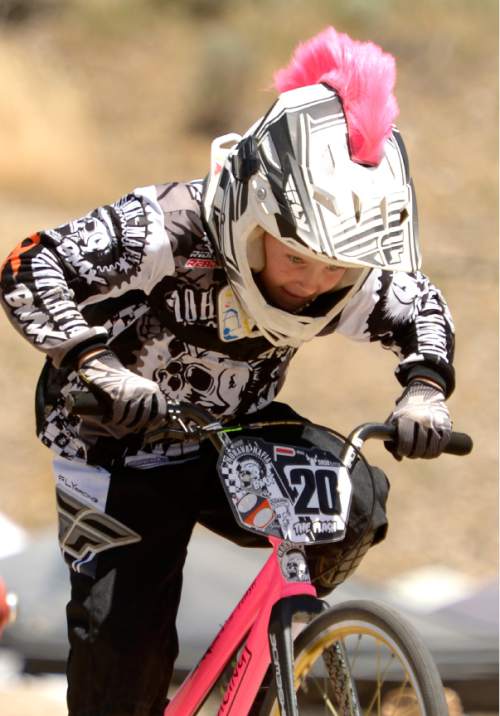 Leah Hogsten  |  The Salt Lake Tribune
Jack Devall from Heber City wears a pink mohawk under and over his helmet as he ride in the expert 8 class. He dyed his hair his favorite color for the event. USA BMX's Great Salt Lake National meet featured riders under 5 to 75-years-old and even a couple Rio-bound Olympic athletes, Saturday, June 18, 2016 at the Rad Canyon BMX track in South Jordan.