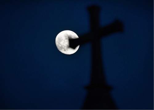 Scott Sommerdorf   |  The Salt Lake Tribune  
Trinity African Methodist Episcopal Church in Salt Lake City lies under the moon Friday, June 17, 2016, before a candlelight vigil to honor the nine victims killed at Emanuel AME Church in Charleston, S.C., a year ago.