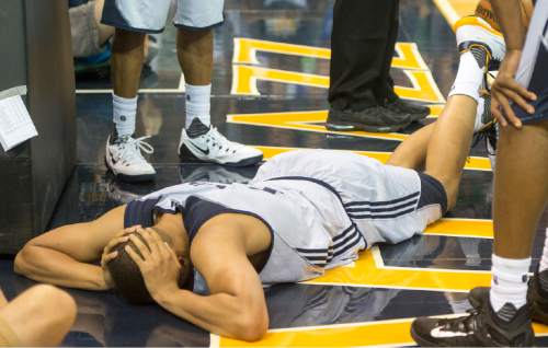 Rick Egan  |  The Salt Lake Tribune

Utah Jazz guard Dante Exum (11) lays on the floor after injuring his ankle, late in the game, in Utah Jazz Summer League action, Utah Jazz vs. The Boston Celtics, at EnergySolutions Arena, Monday, July 6, 2015.