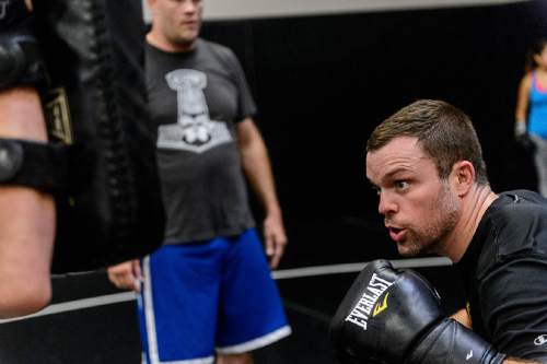 Trent Nelson  |  The Salt Lake Tribune
Sean O'Connell works out at Jeremy Horn's Elite Performance MMA in Sandy, Wednesday June 8, 2016. O'Connell was a walk-on linebacker at the University of Utah, too slow and undersized, who continued to pursue his dream of being a professional athlete through mixed martial arts. He likewise became a sports radio personality, working on a show in the Bay Area on which UFC President Dana White. O'Connell asked White, on air, if he could have a contract. White didn't give him one. So O'Connell worked his way into a UFC contract the hard way, plowing ahead with a tough chin and hard strikes, while gaining a cult following on the Internet for his colorful weigh-in antics. Next week, in Ottawa, is a must-win fight for O'Connell as he vies to stay alive in the UFC.