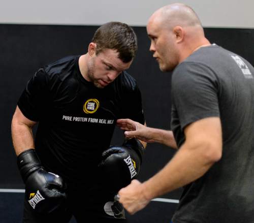 Trent Nelson  |  The Salt Lake Tribune
Sean O'Connell works out with Jeremy Horn at Jeremy Horn's Elite Performance MMA in Sandy, Wednesday June 8, 2016. O'Connell was a walk-on linebacker at the University of Utah, too slow and undersized, who continued to pursue his dream of being a professional athlete through mixed martial arts. He likewise became a sports radio personality, working on a show in the Bay Area on which UFC President Dana White. O'Connell asked White, on air, if he could have a contract. White didn't give him one. So O'Connell worked his way into a UFC contract the hard way, plowing ahead with a tough chin and hard strikes, while gaining a cult following on the Internet for his colorful weigh-in antics. Next week, in Ottawa, is a must-win fight for O'Connell as he vies to stay alive in the UFC.