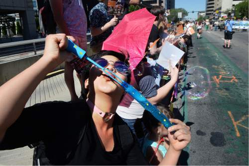 Scott Sommerdorf   |  The Salt Lake Tribune  
"Baby Bayonne" blows bubbles as the 2016 Pride Parade heads up 200S, Sunday, June 5, 2016.