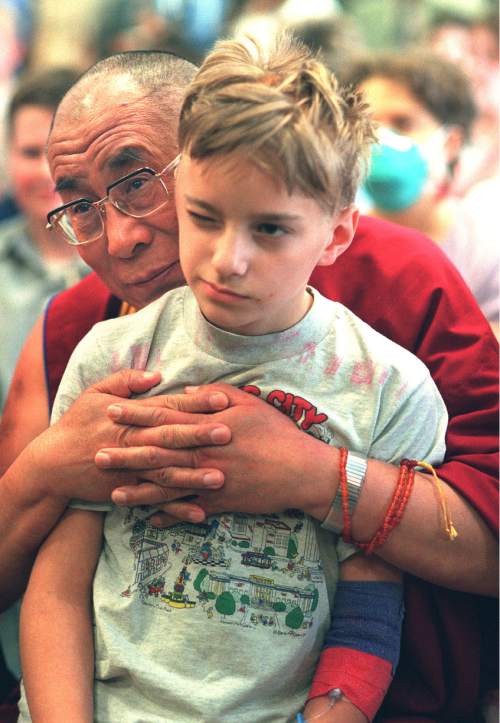 Rick Egan  |  Tribune file photo

The Dalai Lama hugs 13-year-old Richard Gordier, from Ogden, while visiting Primary Children's Hospital on Thursday, May 10, 2001.