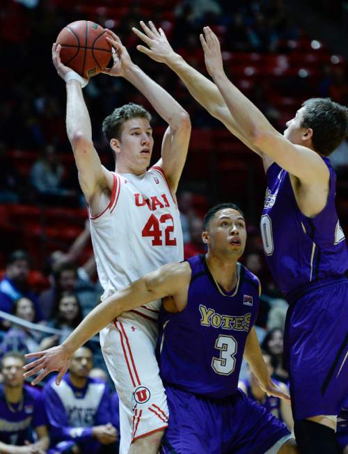 Francisco Kjolseth | The Salt Lake Tribune
Utah Utes forward Jakob Poeltl (42) looks for an open man as Idaho Yotes guard Marck Coffin (3) and Idaho Yotes forward Joey Nebeker (20) put on the pressure in game action at the Huntsman Center on Monday night in the final non-conference game of the season.