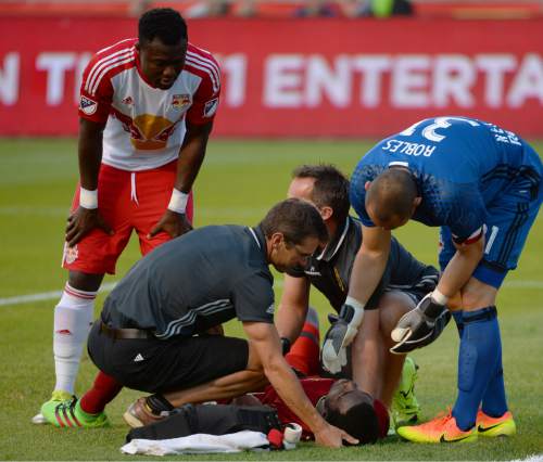 Steve Griffin / The Salt Lake Tribune

New York Red Bulls goalkeeper Luis Robles (31) checks on Real Salt Lake midfielder Stephen Sunny Sunday (8) after he was injured on a corner kick during their game at Rio Tinto Stadium in Sandy Wednesday June 22, 2016.