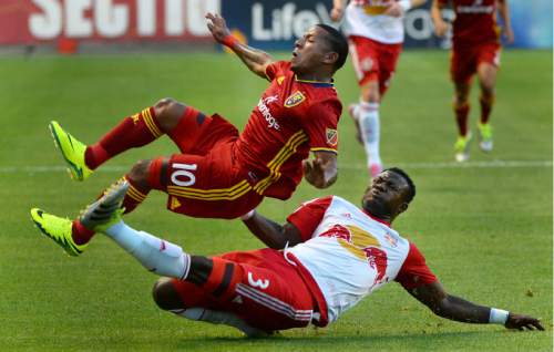 Steve Griffin / The Salt Lake Tribune

New York Red Bulls defender Gideon Baah (3) slides and up ends Real Salt Lake forward Joao Plata (10) during their game at Rio Tinto Stadium in Sandy Wednesday June 22, 2016. Blah was called for a foul on the play.