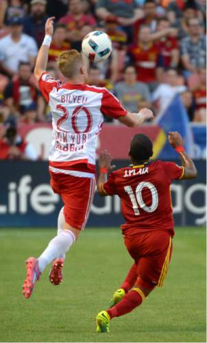 Steve Griffin / The Salt Lake Tribune

New York Red Bulls defender Justin Bilyeu (20) leaps over Real Salt Lake forward Joao Plata (10) as he heads the ball up field during their game at Rio Tinto Stadium in Sandy Wednesday June 22, 2016.