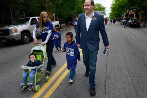 Scott Sommerdorf   |  Tribune file photo
Jonathan Swinton, a Democratic Senate candidate, walks with his family in the Midvale Cinco de Mayo parade. He is running as a conservative Democrat.