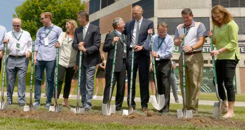 Leah Hogsten  |  The Salt Lake Tribune
Utah Valley University dignitaries, players, coaches and donors celebrate the construction of a new $3.5 million NUVI Basketball Center, a conditioning facility for men's and women's basketball teams during a groundbreaking ceremony for Wednesday, June 22, 2016, on the south side of the UCCU Center.