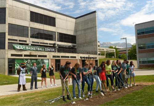 Leah Hogsten  |  The Salt Lake Tribune
Former UVU women's basketball team members and current team members break ground for a photo opportunity. Utah Valley University celebrated the construction of a new $3.5 million NUVI Basketball Center,a conditioning facility for men's and women's basketball teams during a groundbreaking ceremony for Wednesday, June 22, 2016, on the south side of the UCCU Center.