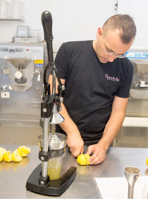Rick Egan  |  The Salt Lake Tribune

Francesco Amendola pours squeezes fresh lemon juice, as he makes lemon sorbet at his Sweetaly gelato shop on 3300 South, Friday, June 3, 2016.