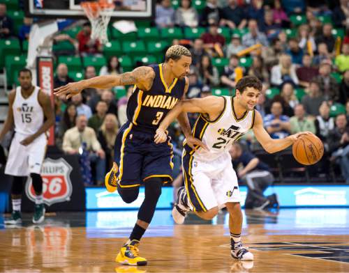 Lennie Mahler  |  The Salt Lake Tribune

Jazz guard Raul Neto leads the fast break by Indiana Pacers guard George Hill in the first half of an NBA basketball game at Vivint Smart Home Arena on Saturday, Dec. 5, 2015.