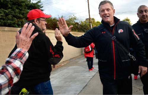 Scott Sommerdorf   |  The Salt Lake Tribune
Utah Utes head coach Kyle Whittingham greets fans on his way into Rice-Eccles Stadium during the "Ute Walk" prior to the Utah - Arizona State game, Saturday, October 17, 2015.