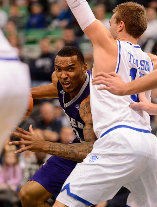 Trent Nelson  |  The Salt Lake Tribune
Weber State's Joel Bolomboy drives on BYU's Jake Toolson as BYU faces Weber State, NCAA basketball at Vivant Smart Home Arena in Salt Lake City, Saturday December 5, 2015.