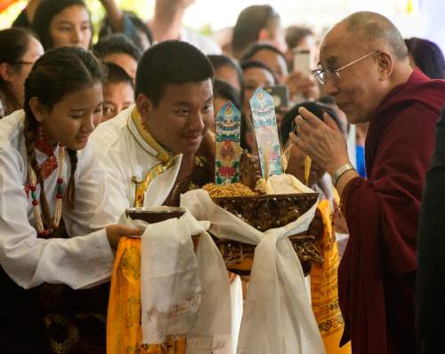 Rick Egan  |  The Salt Lake Tribune

The Utah Tibetan Association greets the Dalai Lama with a ceremonial greeting, as he arrives at the Grand America Hotel, Monday, June 20, 2016.