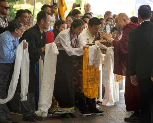 Rick Egan  |  The Salt Lake Tribune

The Utah Tibetan Association greets the Dalai Lama with a ceremonial greeting, as he arrives at the Grand America Hotel, Monday, June 20, 2016.